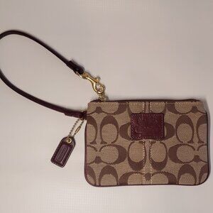 Coach Heritage signature and burgundy wristlet